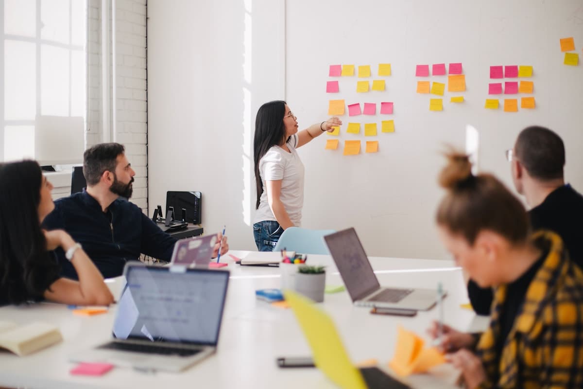 Sales team reviewing a pre-call brief together before a meeting